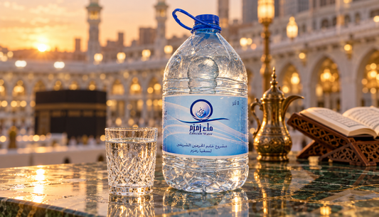 Zamzam water 5-litre bottle and crystal glass at Masjid al-Haram, Makkah, at golden dusk