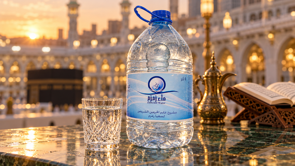 Zamzam water 5-litre bottle and crystal glass at Masjid al-Haram, Makkah, at golden dusk