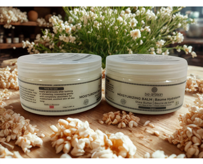 “Be Artisan unscented moisturising balm with shea butter and argan oil in 150g jars, natural fragrance-free skincare displayed with flowers on a wooden surface.”