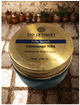 “Be Artisan Nila Scrub jar with gold lid on mosaic Moroccan surface, blue exfoliating scrub suitable for all skin types.”
